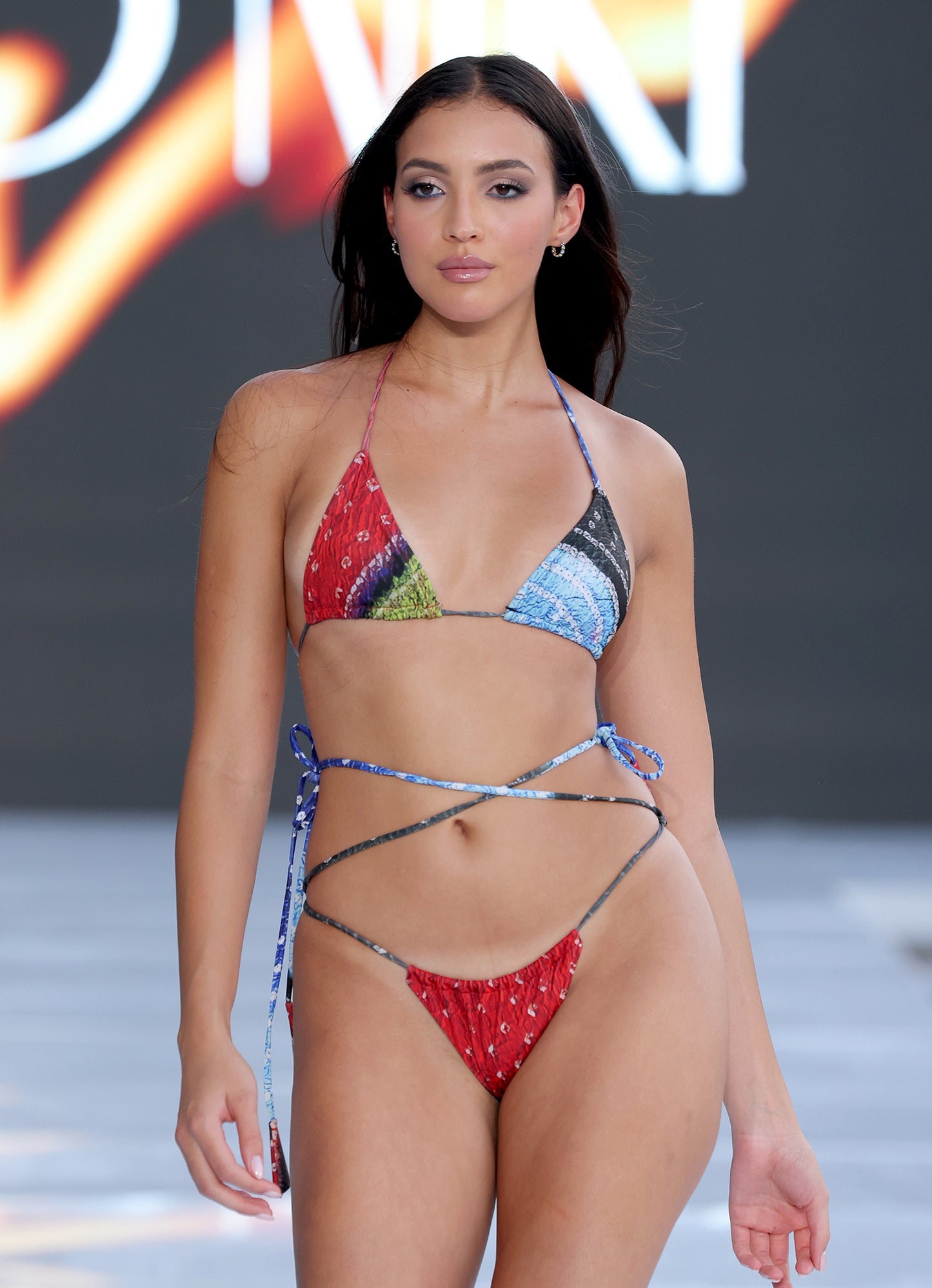 Model wearing Fire Red Ruched Long Ties Bikini Bottom – fully lined and flattering fit